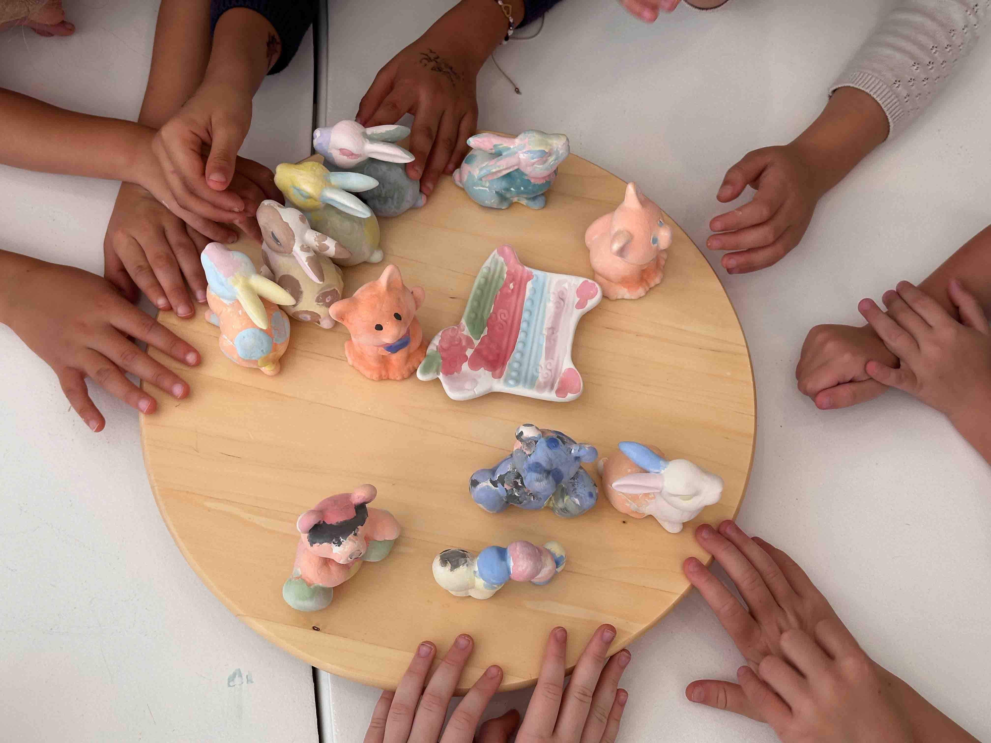 Kids painting ceramics after school with friends