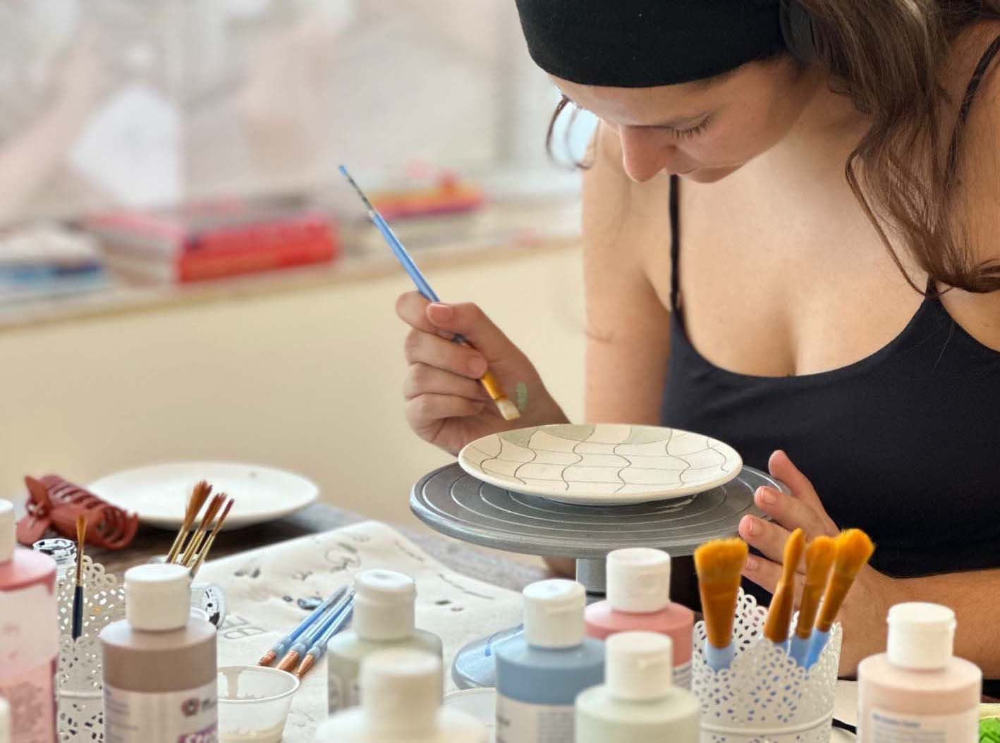 Senior residents enjoying ceramic painting activity